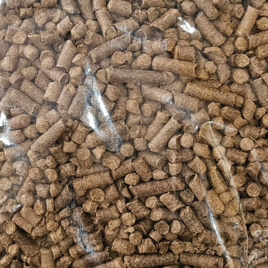 Bag of brown pellets on a white background
