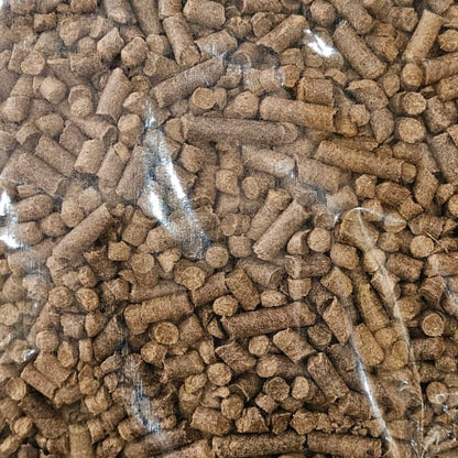 Bag of brown pellets on a white background